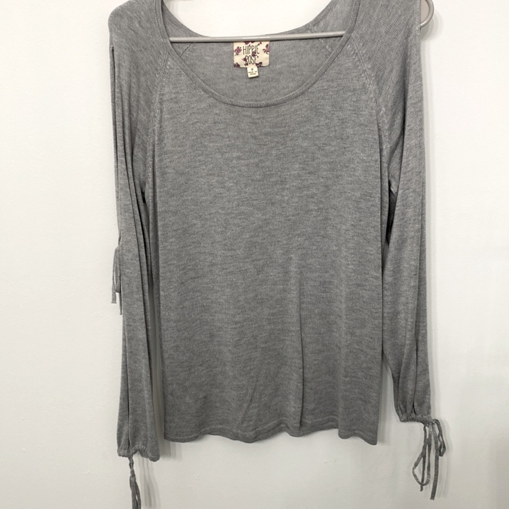 Gray sweater with slits down arms with ties